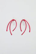 Arc Earrings – Crafted from anodised aluminium, these earrings feature three curved red stems suspended from sterling silver hooks, and are displayed on a plain white background.