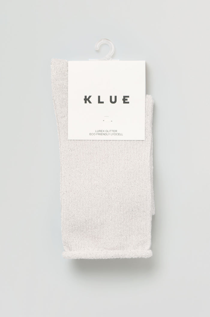 A pair of light gray Bamboo Sparkle Cloud Socks hang on a white plastic hook, labeled "KLUE" with "Eco Friendly Lyocell" printed on the packaging.