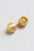 A pair of Brushed Sphere Earrings, featuring round, textured gold plating, are shown on a plain light background.