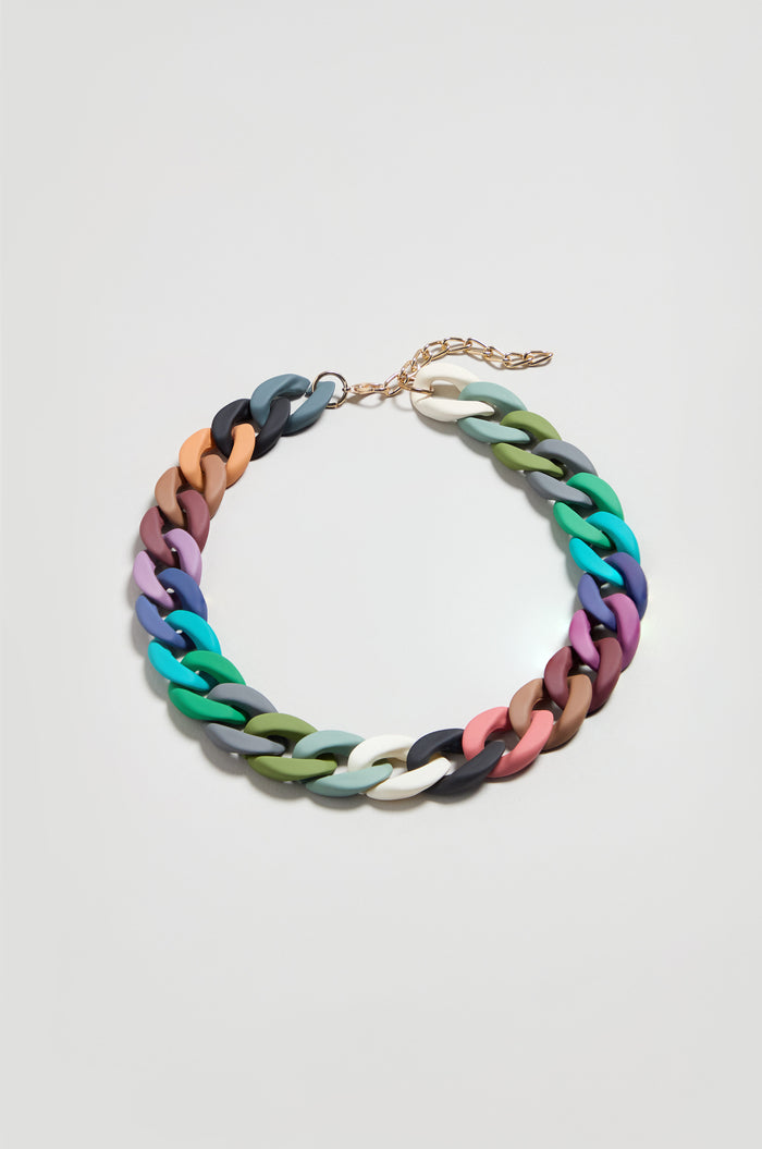 The Colour Pop Link Necklace features vibrant, chunky interlocking links and a gold adjustable clasp—a bold statement piece perfect for adding color to any outfit. Shown on a simple light background.