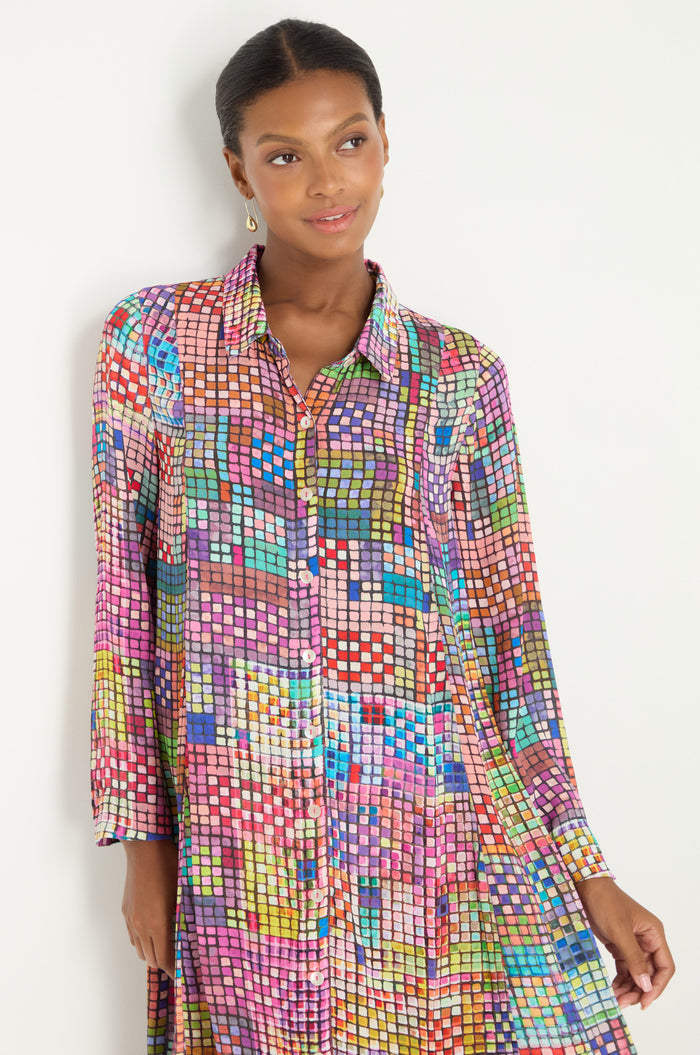 Close-up of the Coloured Glass Tiles Shirt Dress, showcasing its vibrant, mosaic-inspired square pattern in bright shades with a visible sleeve and side seam.