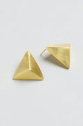 Folded Triangle Earrings crafted from recycled brass in a gold-tone geometric pyramid design, displayed on a light gray background; one earring lies flat while the other shows the back post.