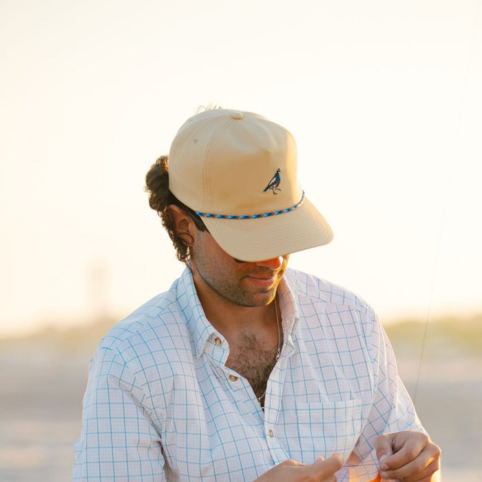 man wearing quail hat