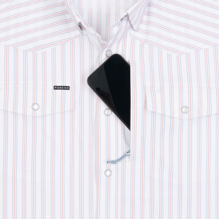 Phone in chest zipper pocket of shirt