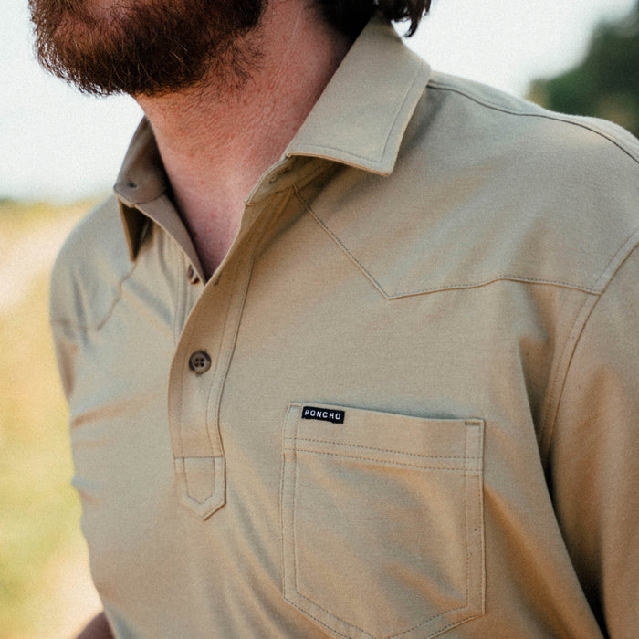 man wearing yellow/tan polo shirt