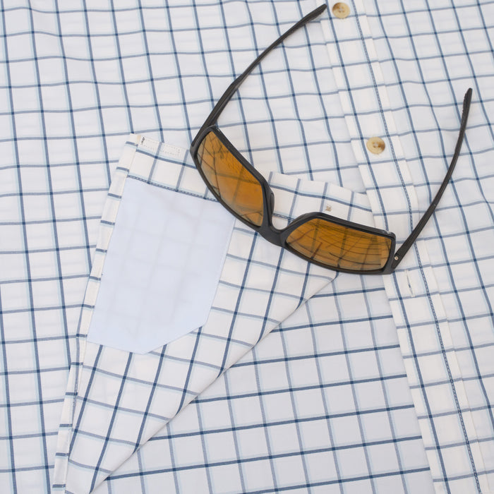 Sunglasses on hidden fabric cleaner of blue plaid shirt