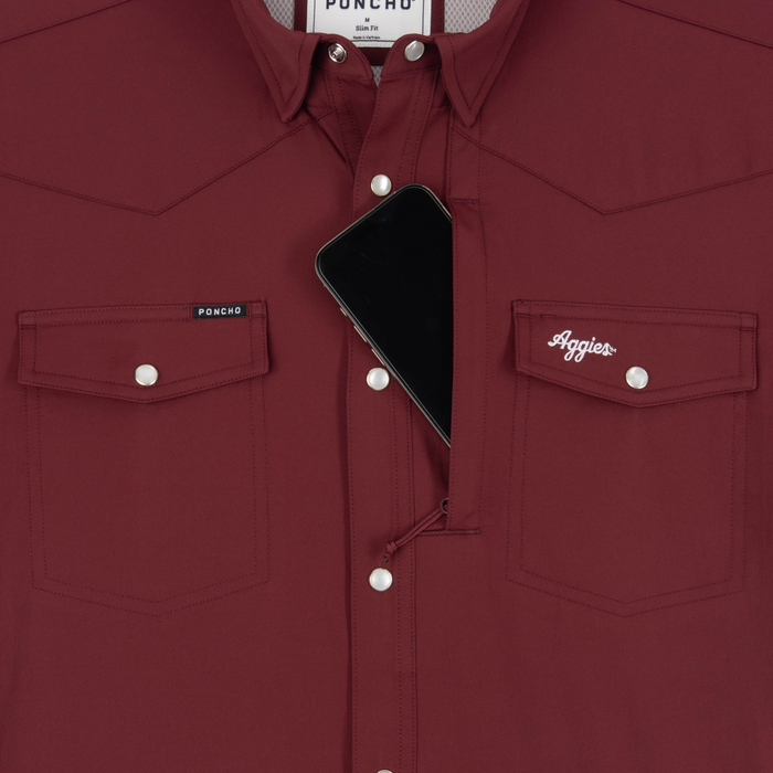 Phone in chest zipper pocket of shirt