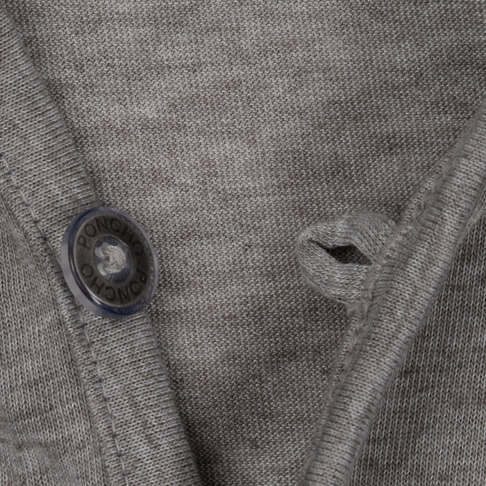 Close-up of grey breathable fabric and button detail on The Albright shirt