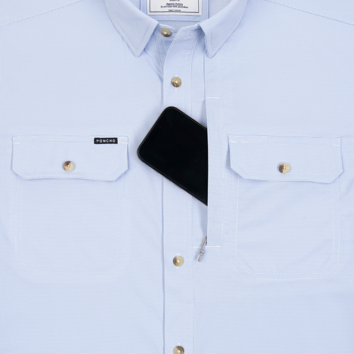Phone in chest zipper pocket of shirt