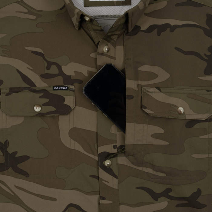 Phone in chest zipper pocket of shirt