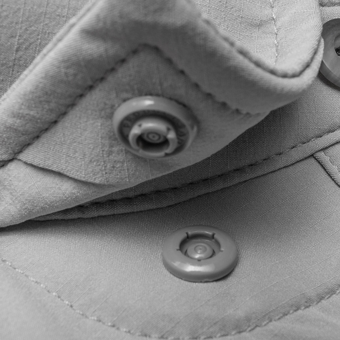 Closeup of collar snaps on collar of shirt