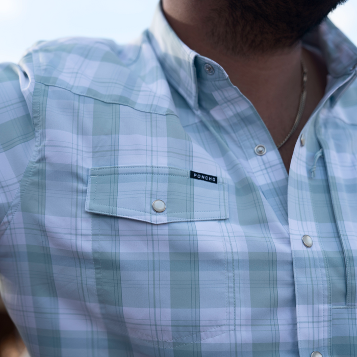 man wearing the big sky shirt