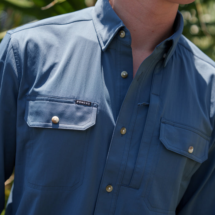 The Bigeye blue shirt with button front and dual flap chest pockets outdoors