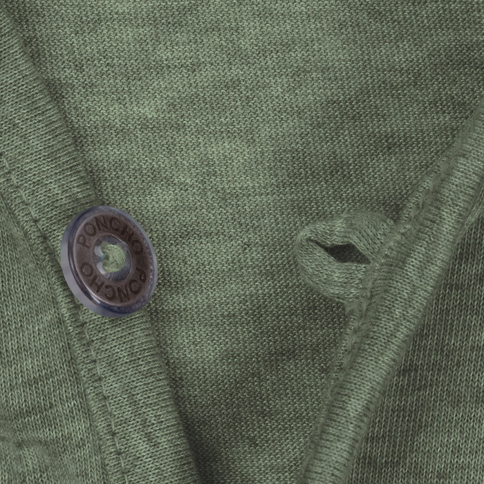 Close-up of moss green breathable shirt fabric with button and loop detail from The Boundary Waters