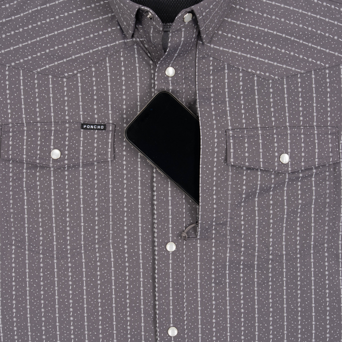 Phone in chest zipper pocket of shirt