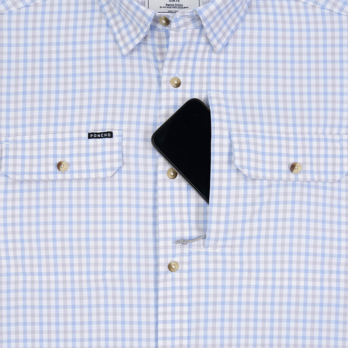 Phone in chest zipper pocket of shirt