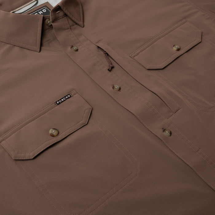 Close-up of a brown outdoor shirt with buttoned pockets from The Clark collection