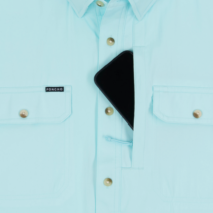 phone in chest zipper pocket of shirt