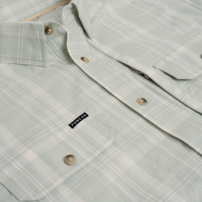 Close up of green plaid button down