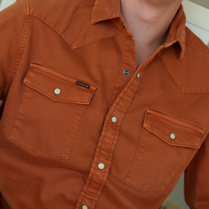 The Darrell orange button up shirt with utility pockets and rugged stitching by Poncho Outdoors