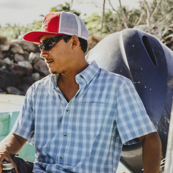 Man wearing blue button down short sleeve shirt