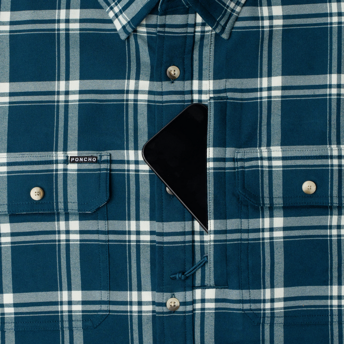 phone in chest zipper pocket of shirt