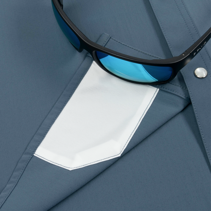 sunglasses with lens cleaner on shirt
