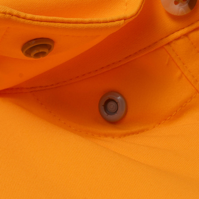 Close-up of orange fabric and button details on The First and Goal shirt