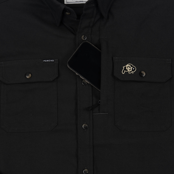 phone in chest zipper pocket of shirt