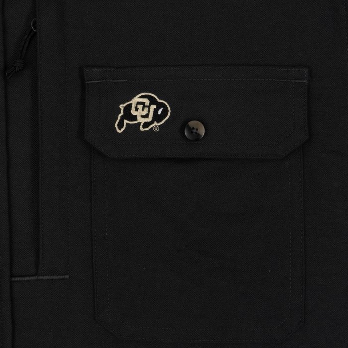 closeup of logo on pocket of shirt