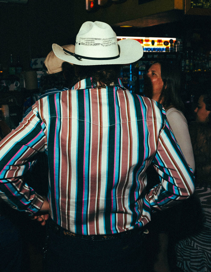The Frontman striped outdoor shirt worn by a man with a white cowboy hat