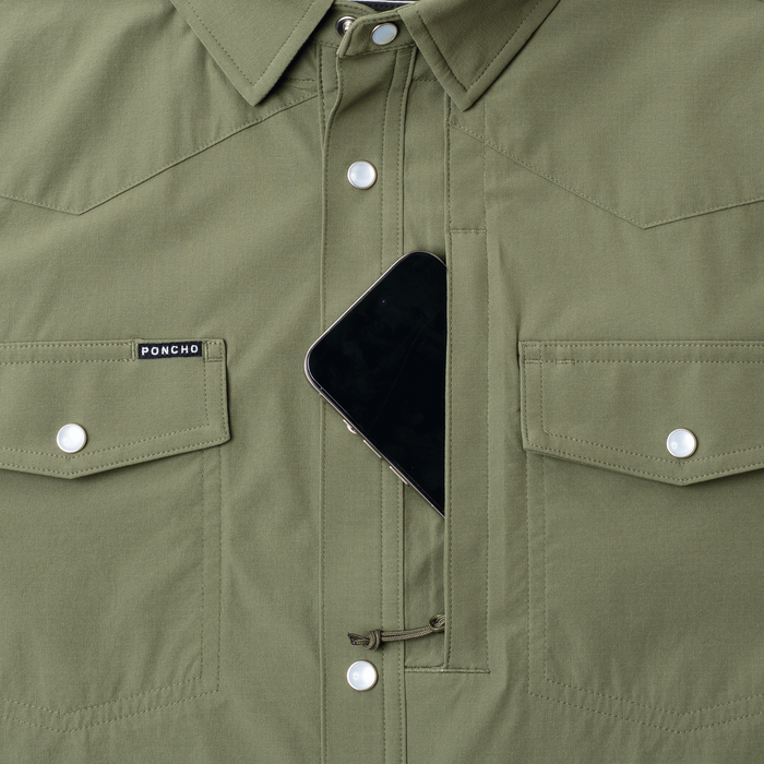 phone in chest zipper pocket of shirt