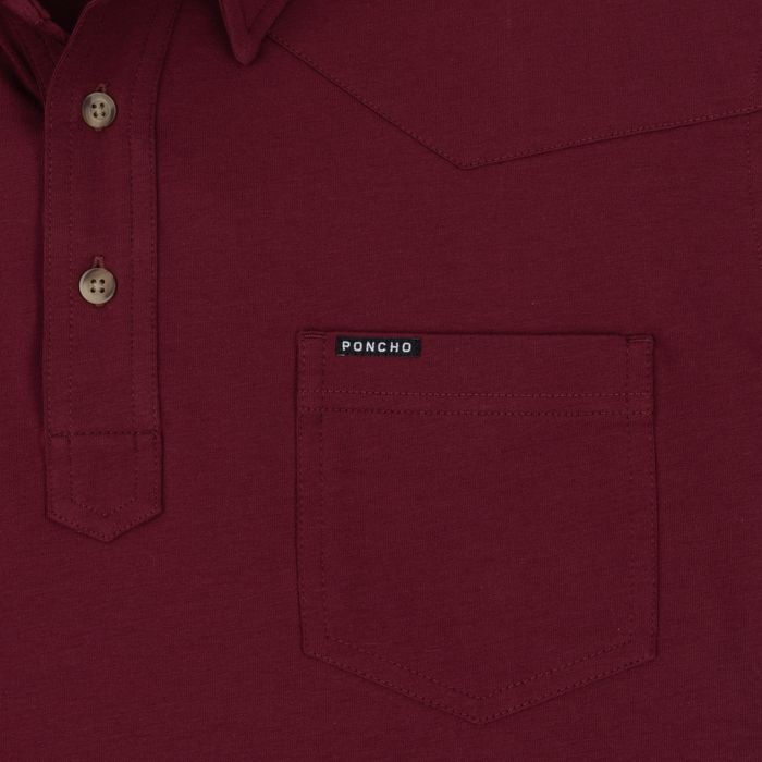 Close-up of burgundy shirt pocket with Poncho label from The Gridiron