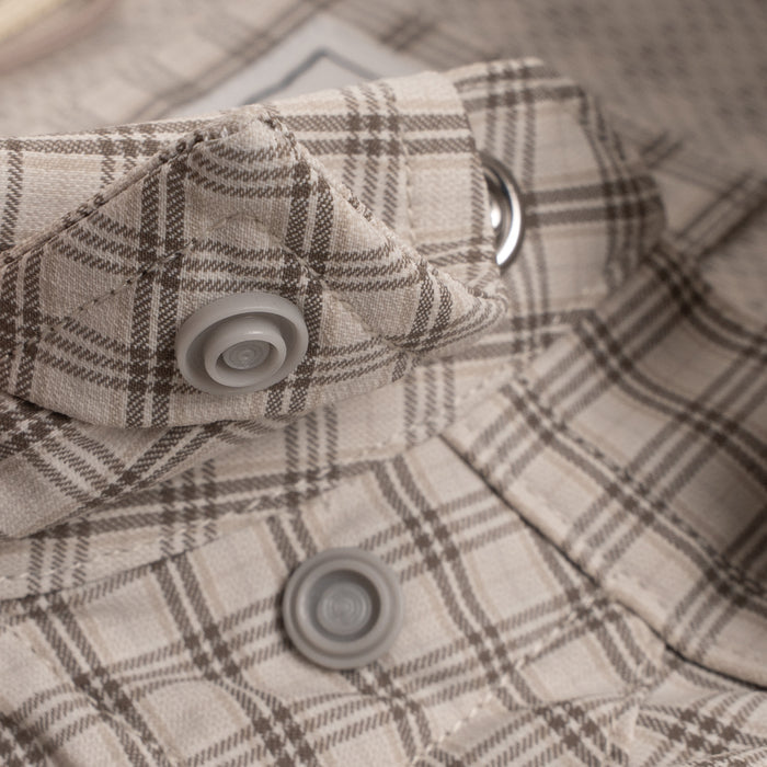 Close up of collar snaps on brown pearl snap
