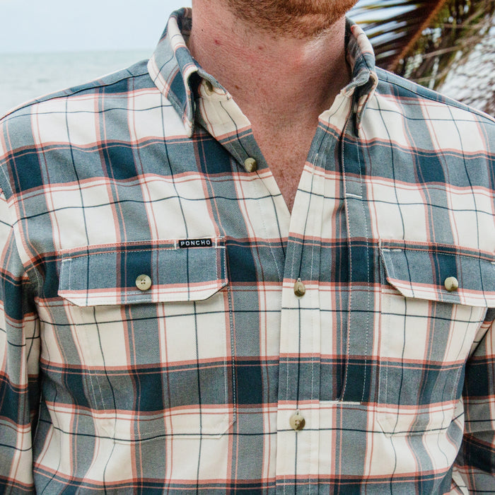 The Half Moon plaid button up shirt with chest pockets worn outdoors