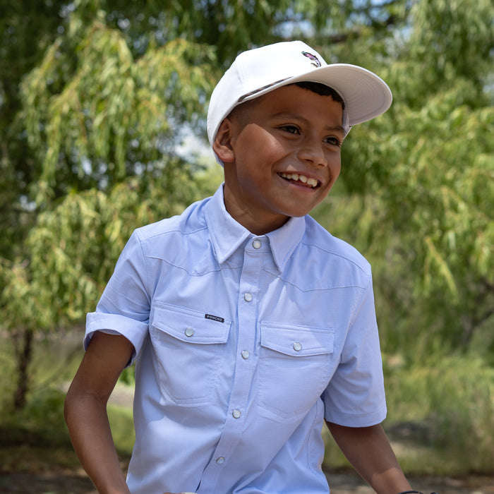 kid wearing blue pearl snap short sleeve shirt