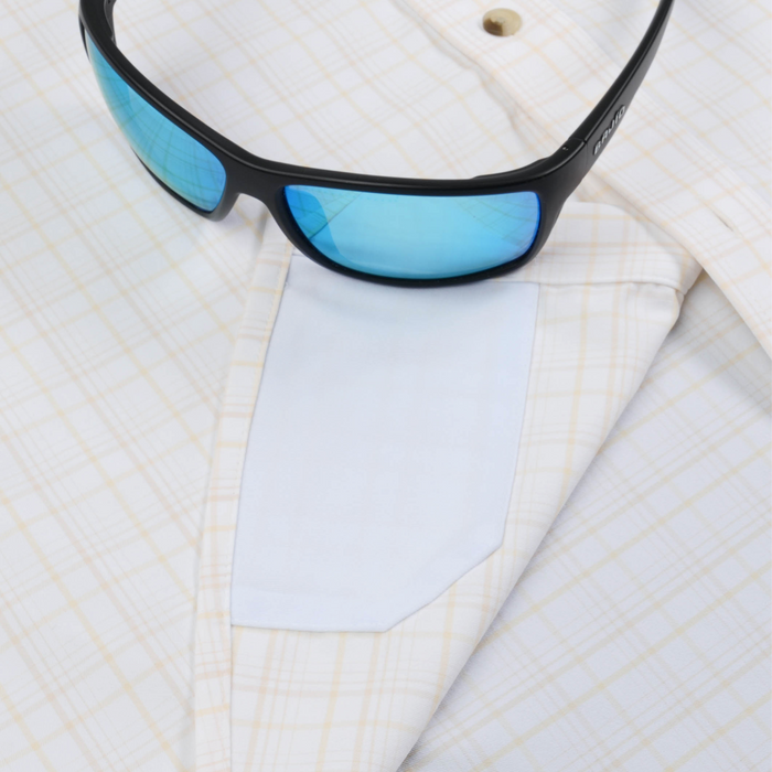 The Horn Island white plaid shirt styled with blue tinted sunglasses
