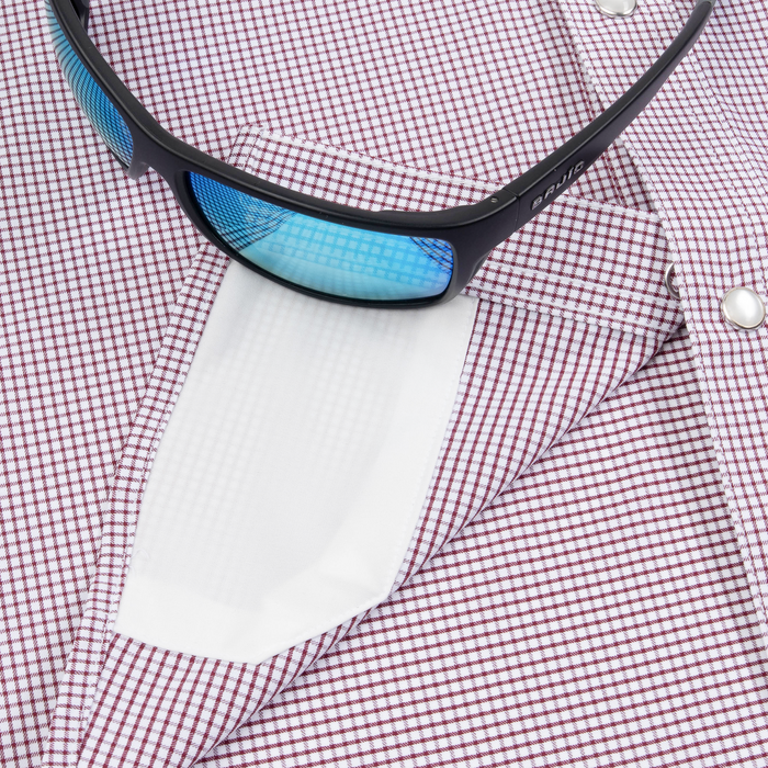Closeup of sunglasses with lens cleaner on shirt