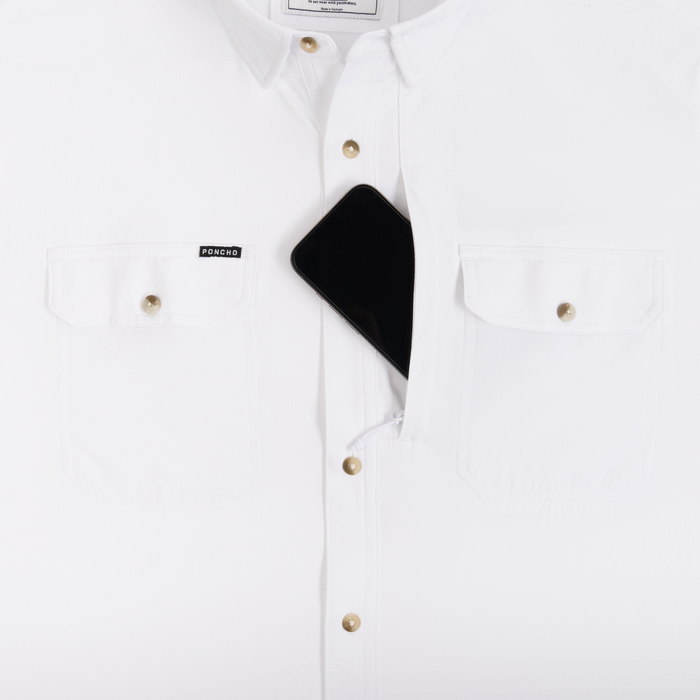 Phone in chest zipper pocket of shirt