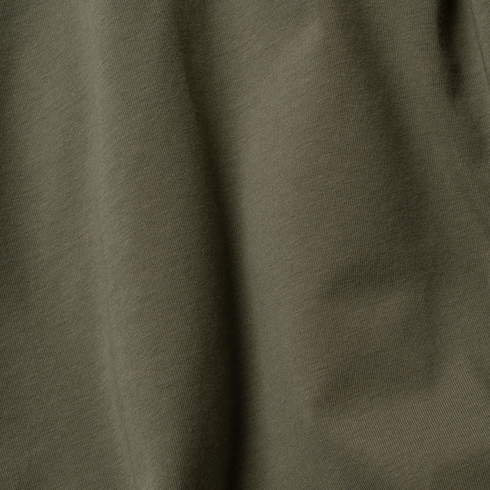 Close-up of olive green fabric texture for The Jalapeno Cream Cheese shirt