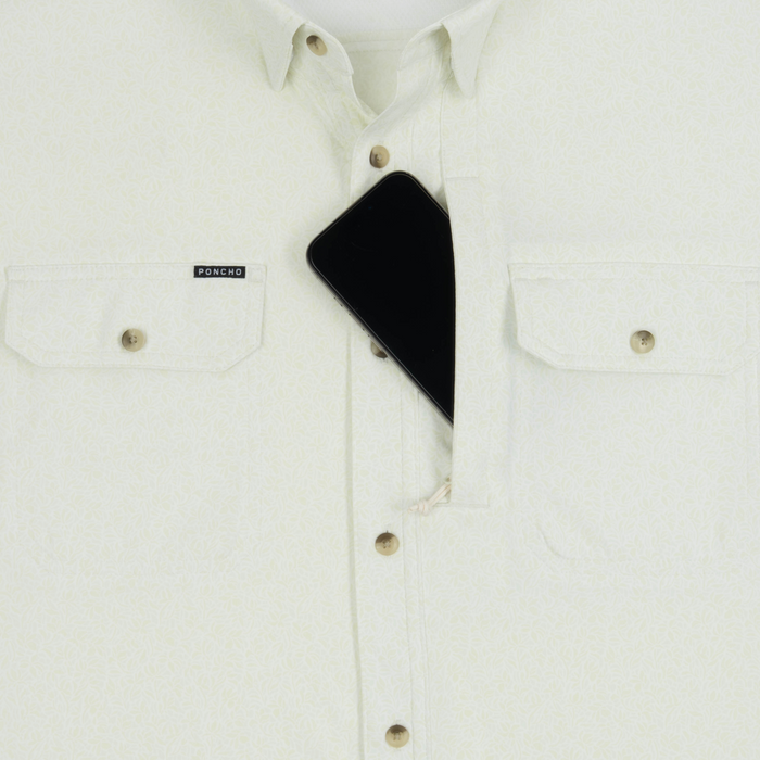 Phone in chest zipper pocket of shirt