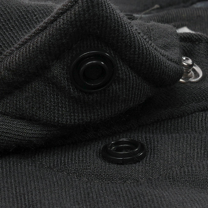 Close-up of black fabric snap buttons on The Laramie shirt