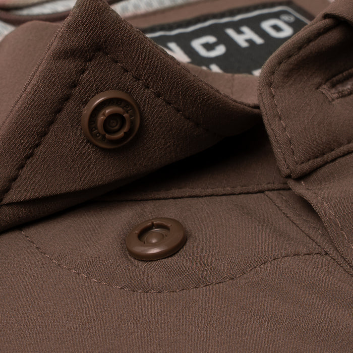 Close-up of brown button and collar detail on The Lewis outdoor shirt by Poncho Outdoors