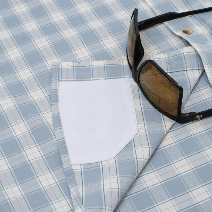 Close up of hidden sunglass cleaner on button down shirt