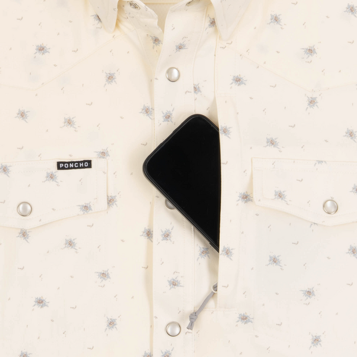 Phone in chest zipper pocket of shirt