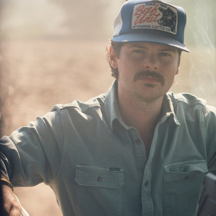 The Mentone shirt worn by a man outdoors in warm sunlight