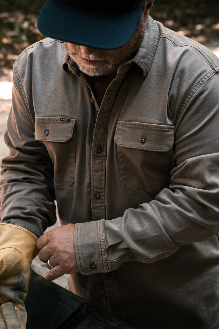 The Monteagle gray button up shirt worn by a man outdoors