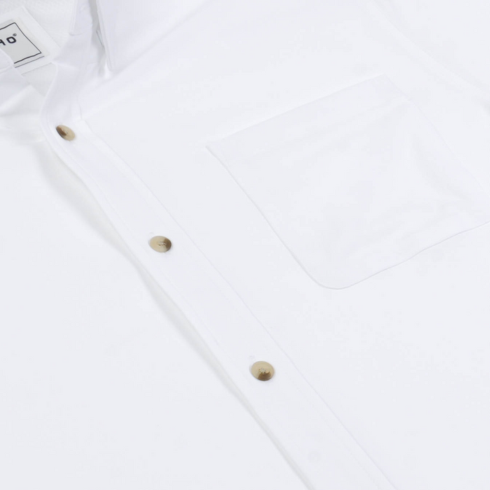 The Mountain Goat white shirt with a front pocket and brass buttons
