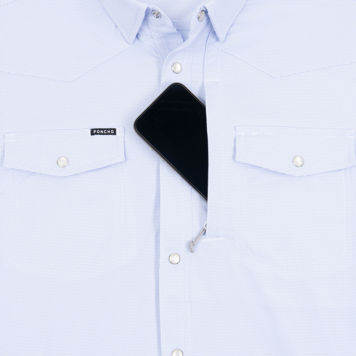 Phone in chest zipper pocket of shirt