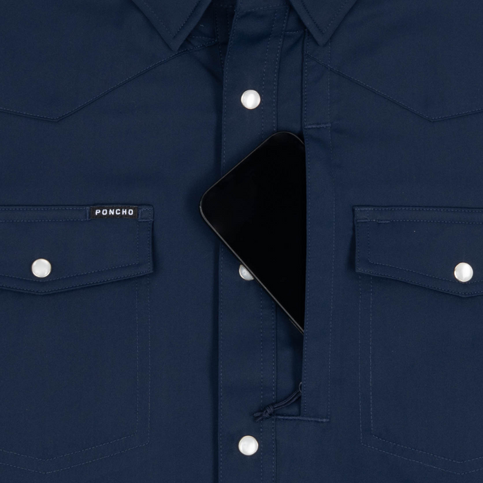Phone in chest zipper pocket of shirt